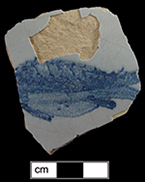 Bowl fragment decorated in blue with a fish motif - Fish decorated punch bowls were very popular in the American colonies between the 1740s to the mid 1770s (Lange 2001:48).